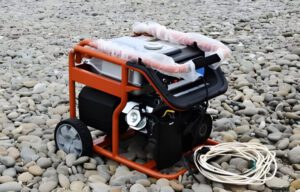 Portable generator on rocky ground.