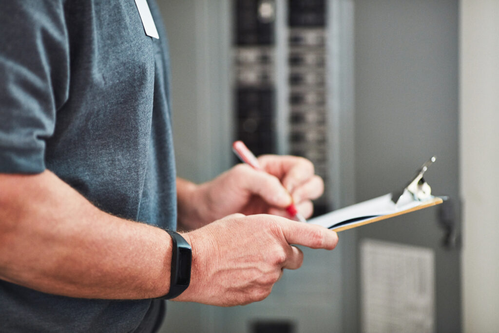 A licensed electrician does a commercial electrical safety checklist